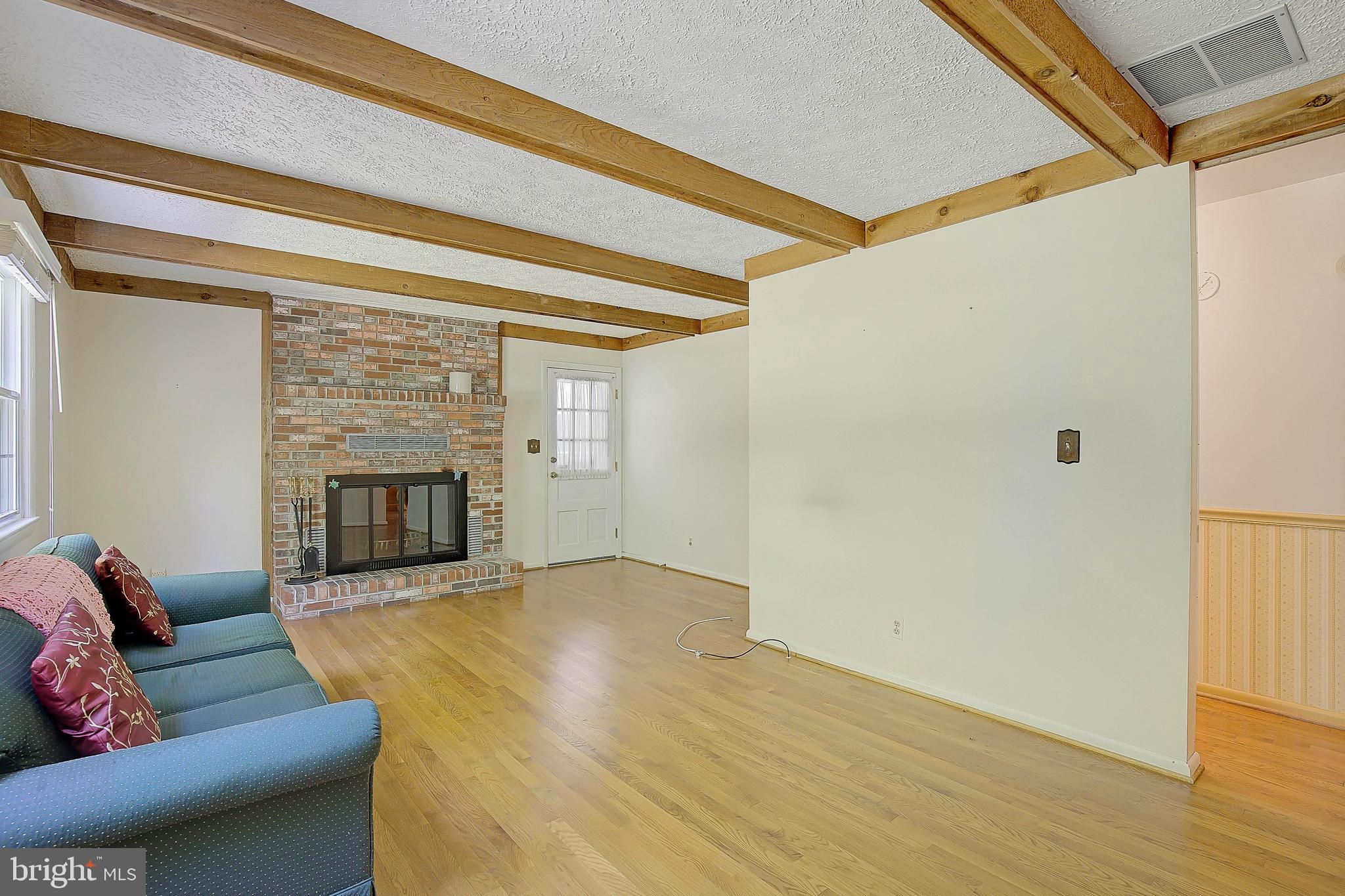 1750 Timber Court Huntingtown, MD 20639 - Photo 2 of 57 a living room with furniture and a fireplace