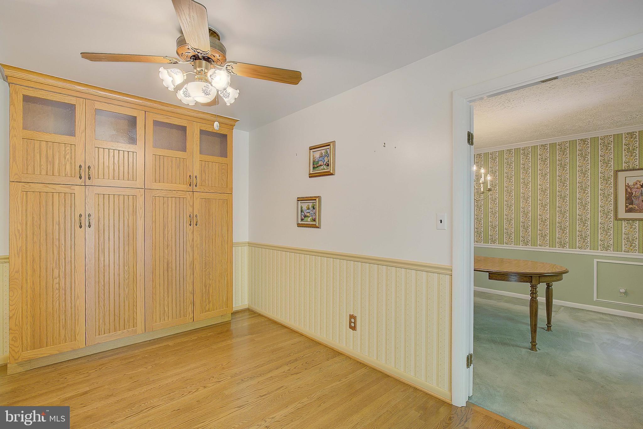 1750 Timber Court Huntingtown, MD 20639 - Photo 22 of 57 a view of empty room with wooden floor and fan