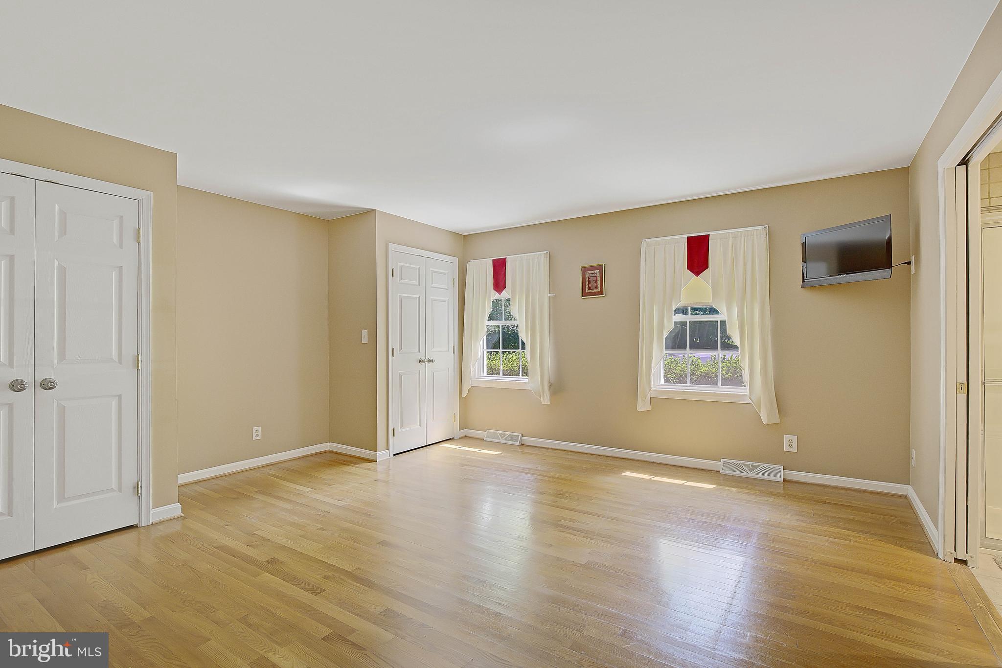 1750 Timber Court Huntingtown, MD 20639 - Photo 32 of 57 an empty room with wooden floor and windows