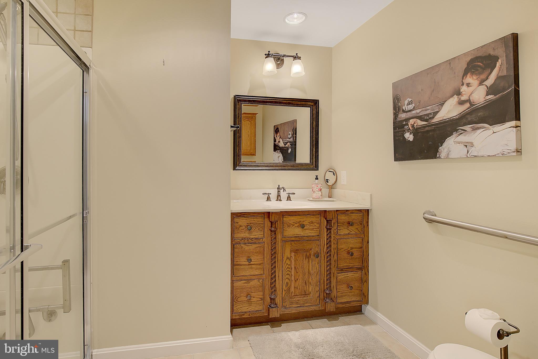 1750 Timber Court Huntingtown, MD 20639 - Photo 35 of 57 a bathroom with a sink and mirror