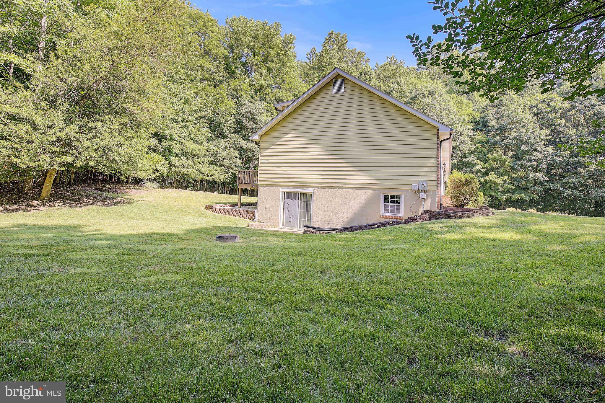 1750 Timber Court Huntingtown, MD 20639 - Photo 38 of 57 a view of a house with a yard and sitting area