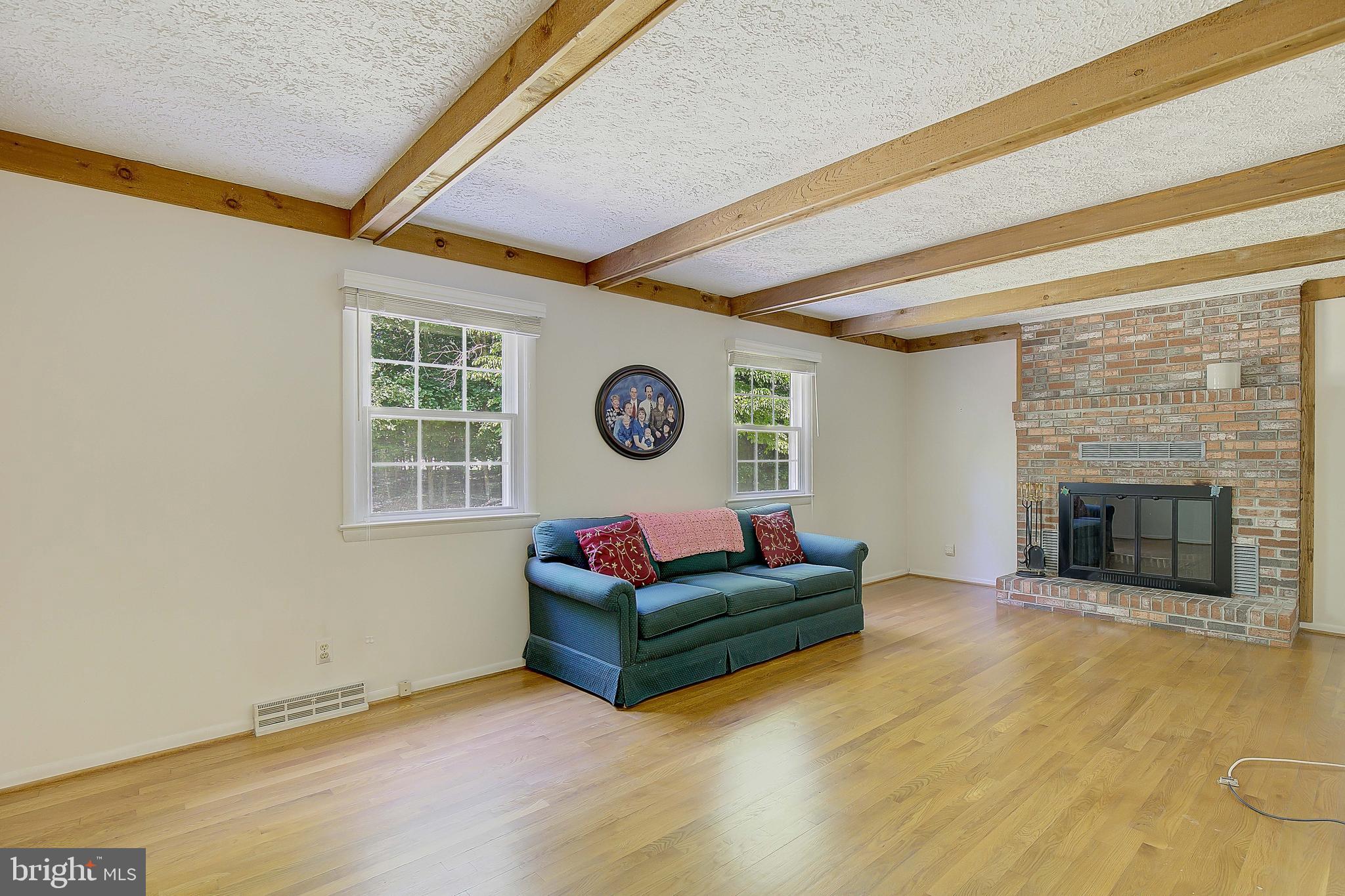 1750 Timber Court Huntingtown, MD 20639 - Photo 40 of 57 a living room with furniture and a fireplace
