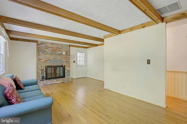 a view of a garage with wooden floor