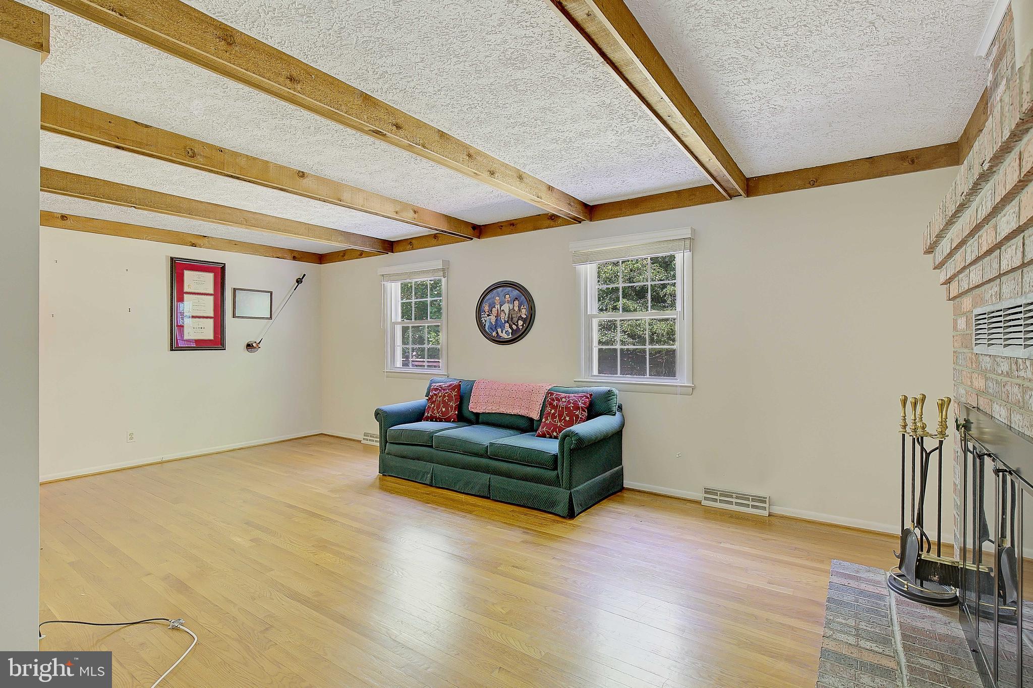 1750 Timber Court Huntingtown, MD 20639 - Photo 42 of 57 a living room with furniture and a wooden floor