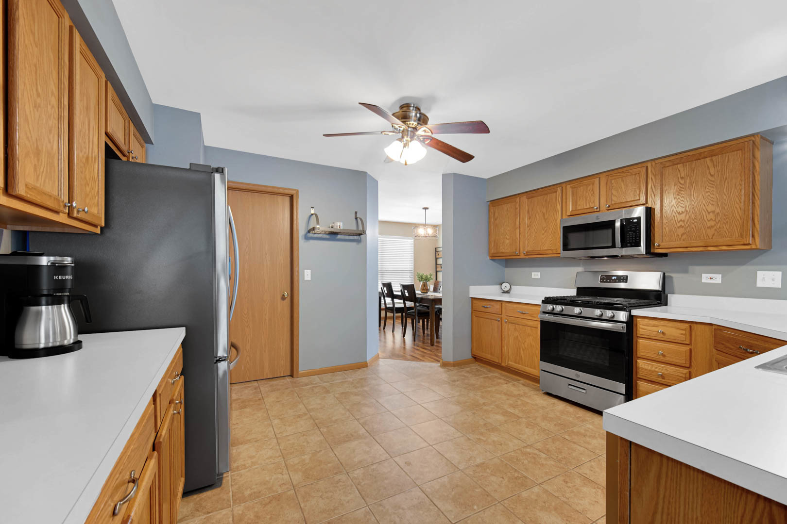 274 Spring Valley Way Round Lake, IL 60073 - Photo 12 of 28 a kitchen with stainless steel appliances granite countertop a refrigerator a stove top oven a sink and dishwasher