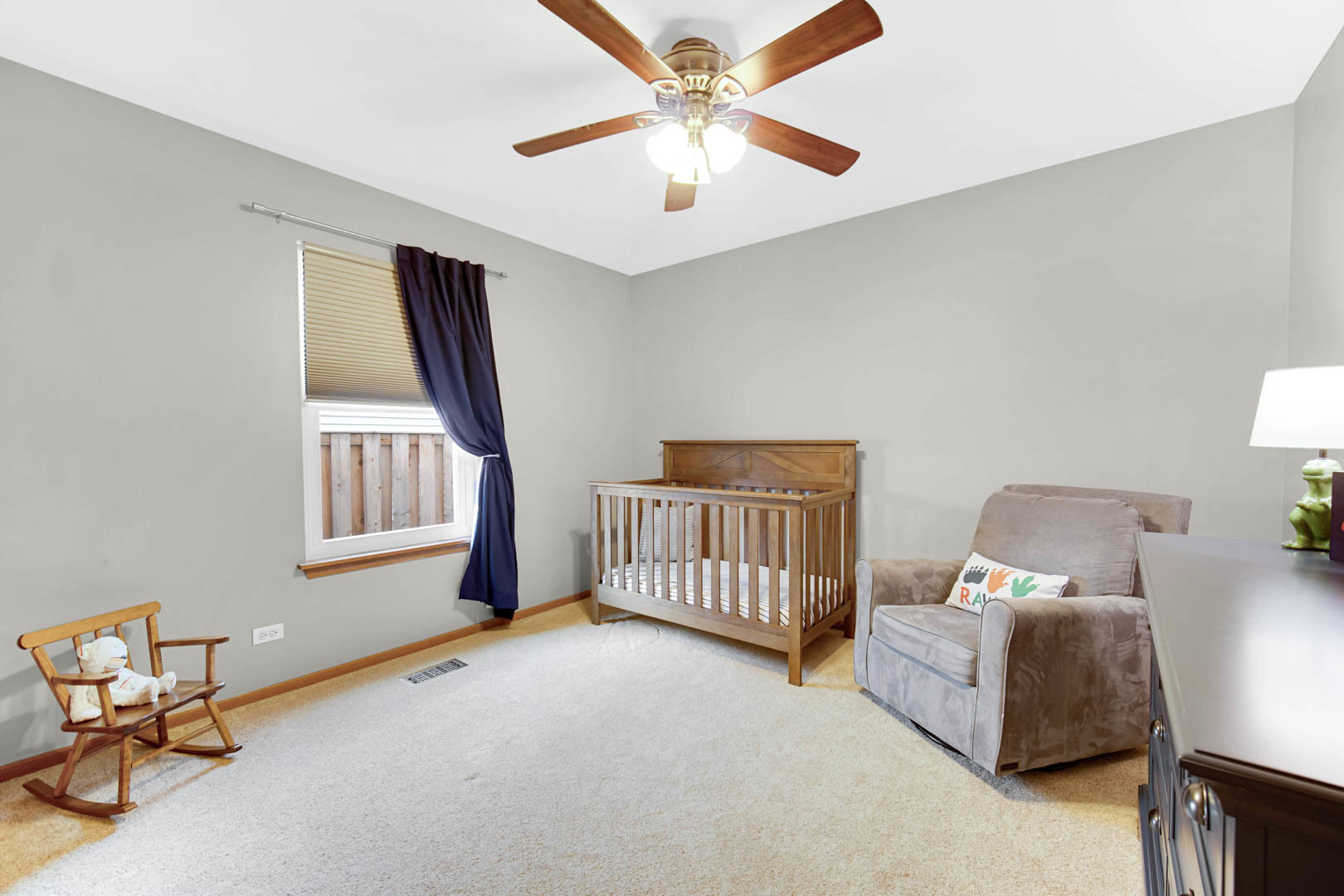 274 Spring Valley Way Round Lake, IL 60073 - Photo 13 of 28 a bedroom with furniture and a window
