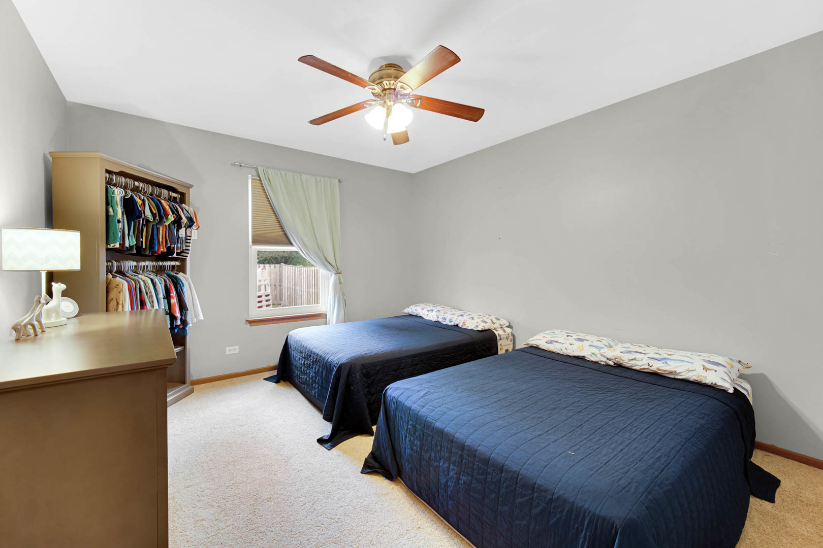 274 Spring Valley Way Round Lake, IL 60073 - Photo 14 of 28 a bedroom with a bed and a table in it