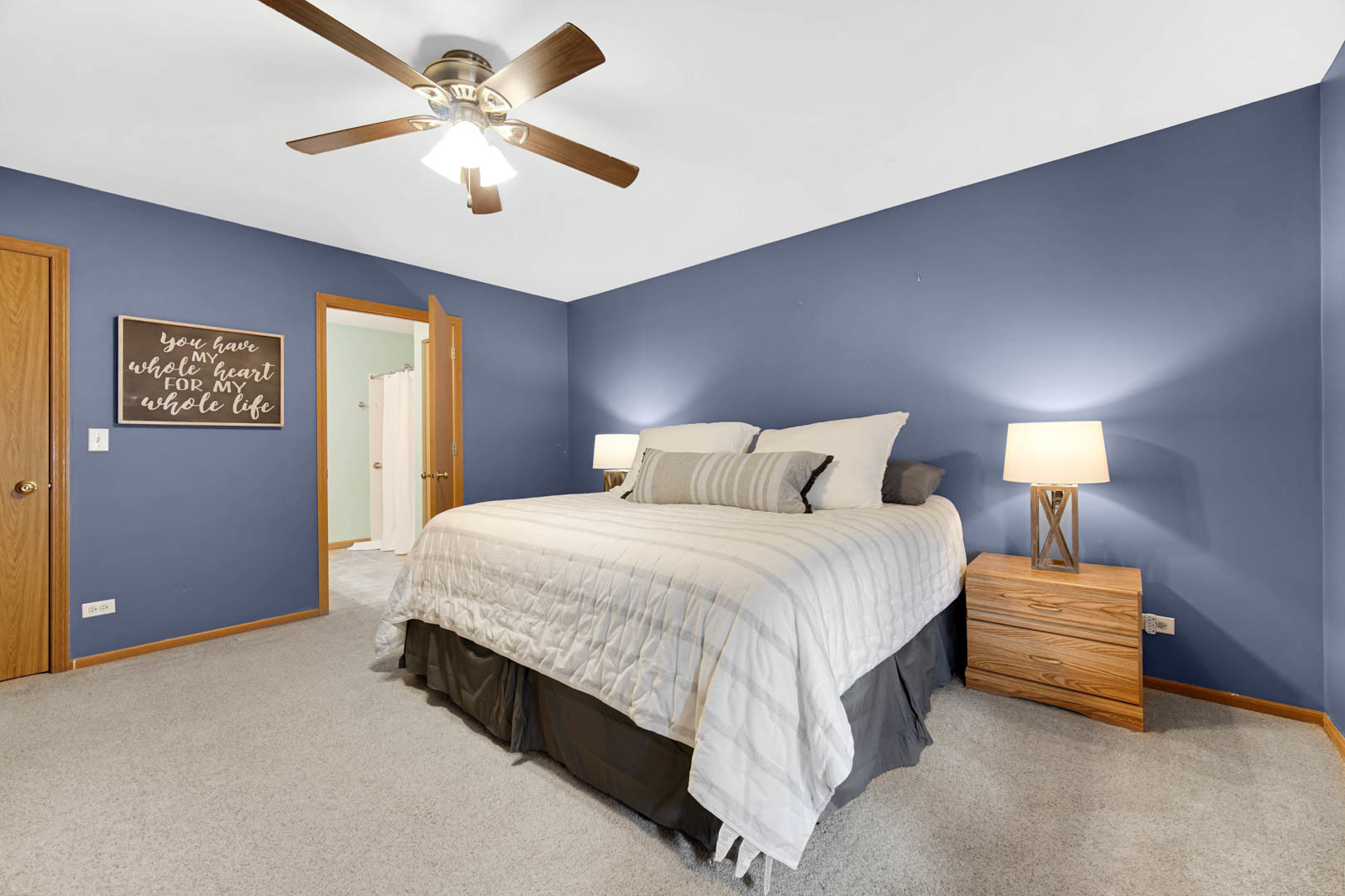 274 Spring Valley Way Round Lake, IL 60073 - Photo 17 of 28 a spacious bedroom with a bed and a ceiling fan