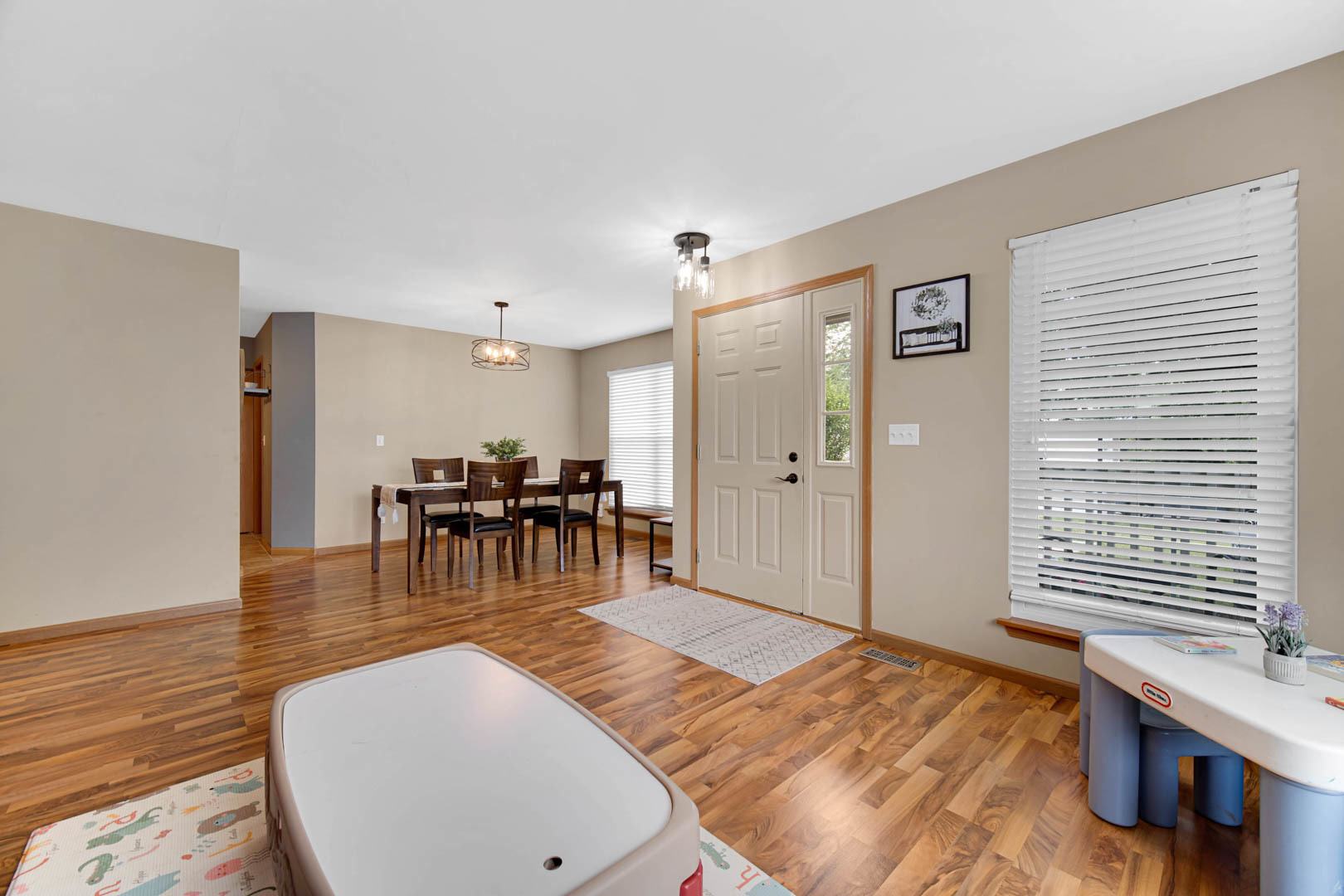 274 Spring Valley Way Round Lake, IL 60073 - Photo 3 of 28 a view of a livingroom with furniture and dining area