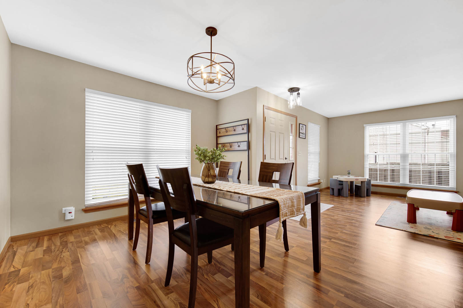 274 Spring Valley Way Round Lake, IL 60073 - Photo 4 of 28 a view of a dining room with furniture window and wooden floor