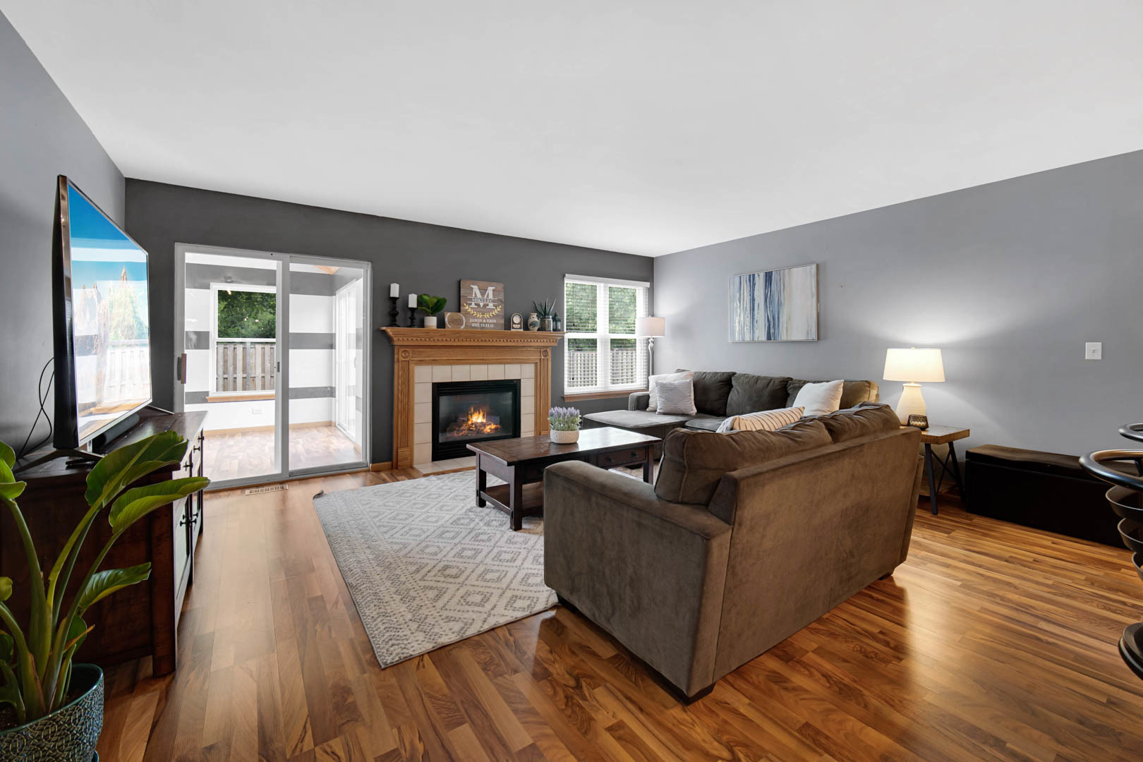274 Spring Valley Way Round Lake, IL 60073 - Photo 6 of 28 a living room with furniture and a fireplace