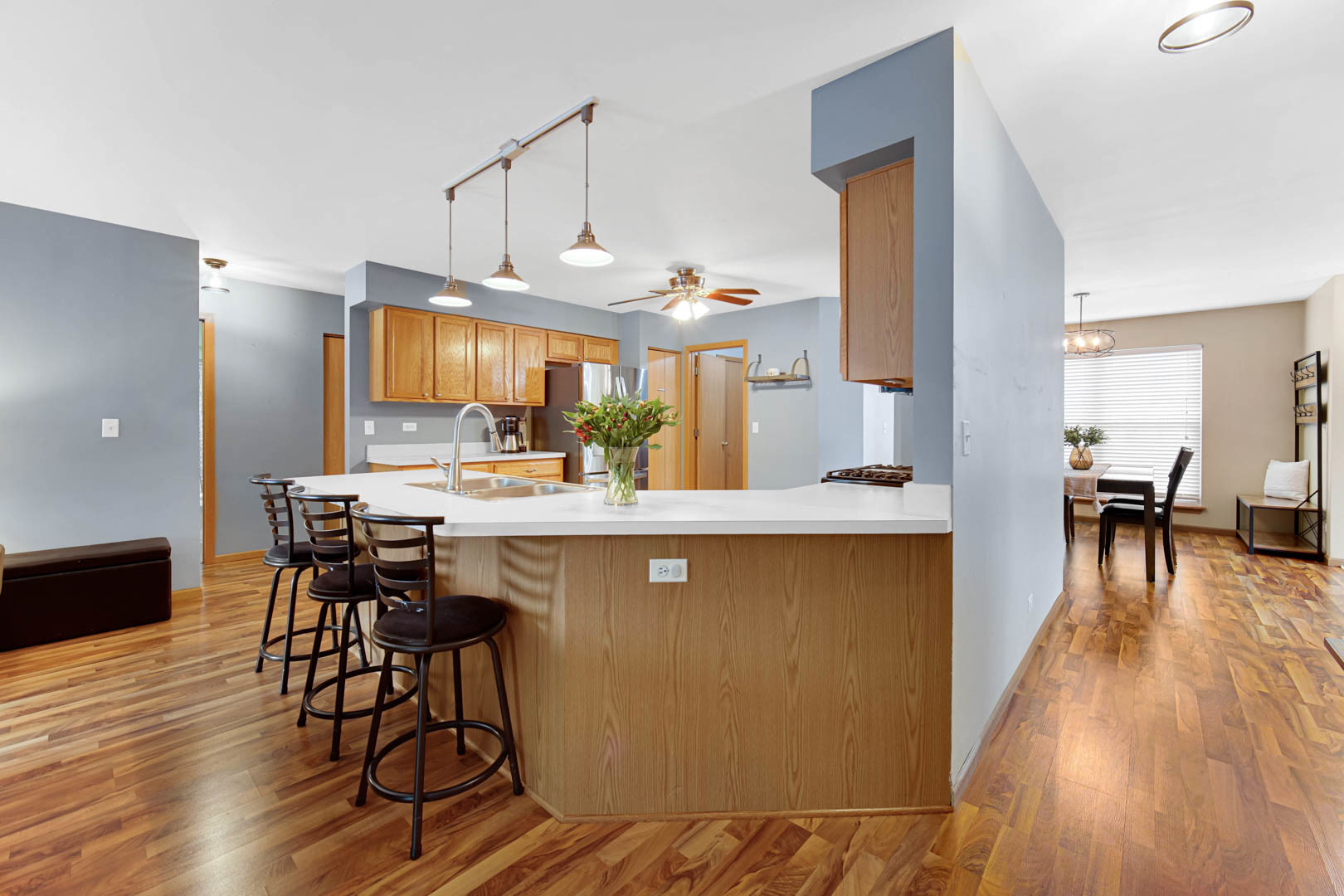 274 Spring Valley Way Round Lake, IL 60073 - Photo 9 of 28 a kitchen with a table chairs and a wooden floor