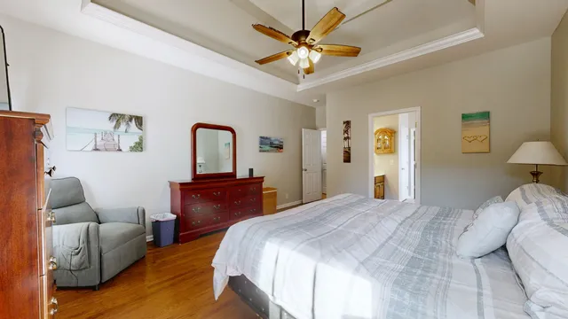 a bedroom with a bed couch and a window