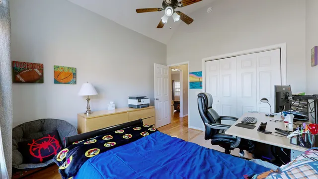 a bedroom with a workspace