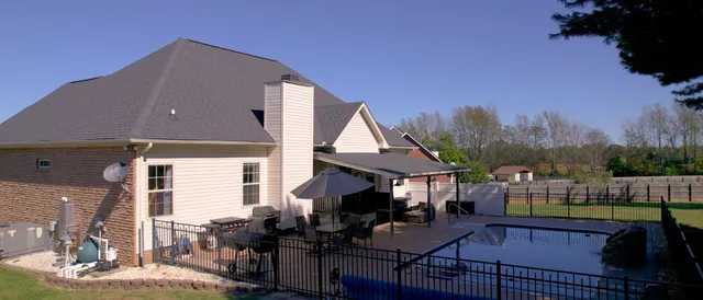 a view of house with outdoor seating space