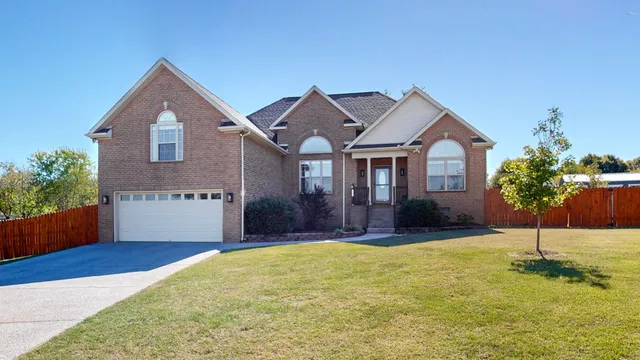 a front view of a house with a yard