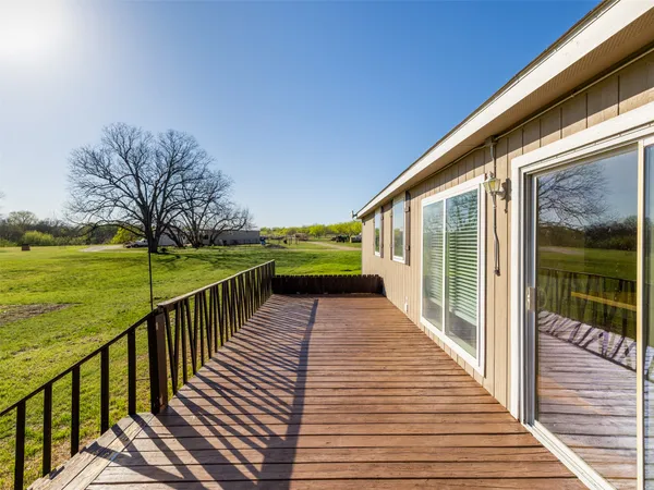 a balcony with wooden floor