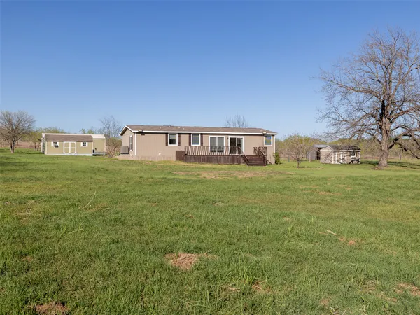 a view of a house with a big yard