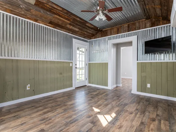 a view of a livingroom with wooden floor