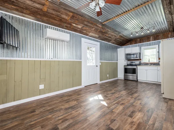 a view of a livingroom with a kitchen