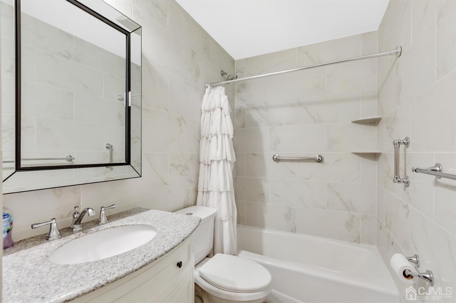20 Hill Road Edison, NJ 08817 - Photo 14 of 15 a bathroom with a granite countertop sink toilet mirror and shower