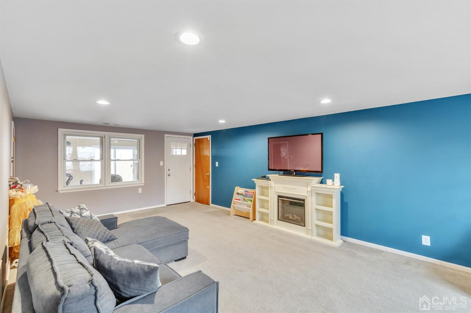 20 Hill Road Edison, NJ 08817 - Photo 3 of 15 a living room with furniture and a flat screen tv