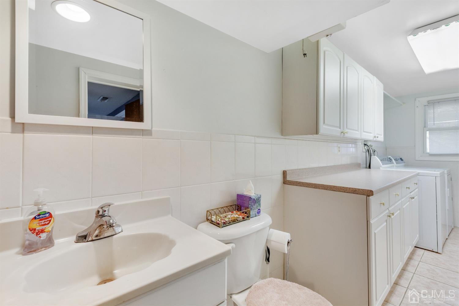 20 Hill Road Edison, NJ 08817 - Photo 8 of 15 a bathroom with a sink toilet and a mirror
