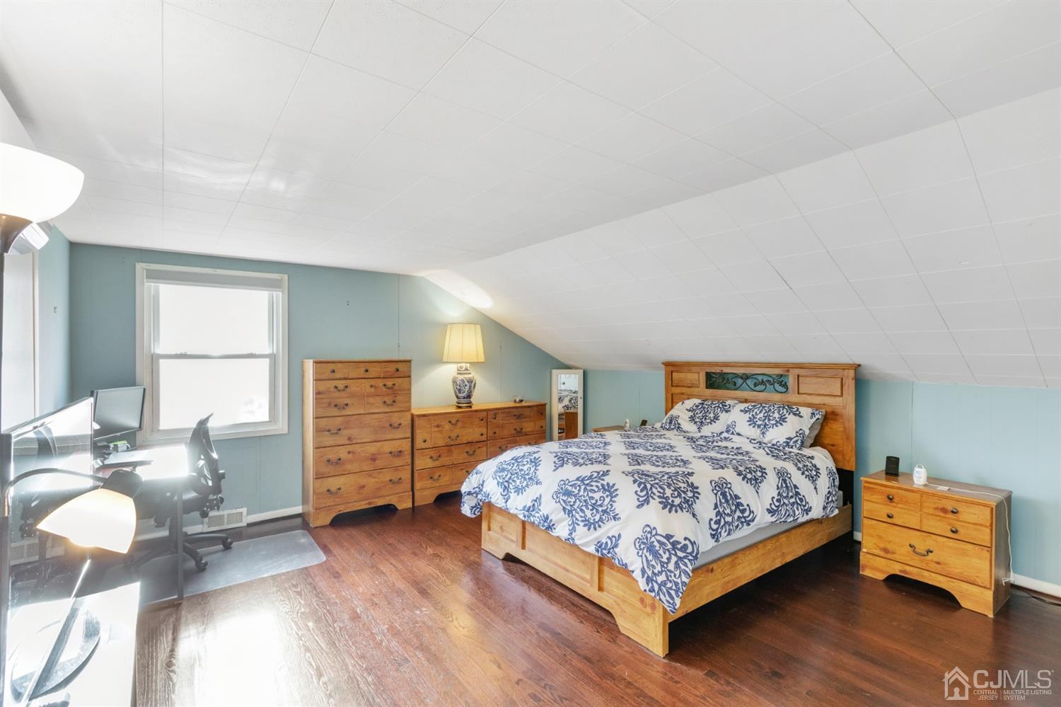 20 Hill Road Edison, NJ 08817 - Photo 9 of 15 a bedroom with a bed and dresser with wooden floor