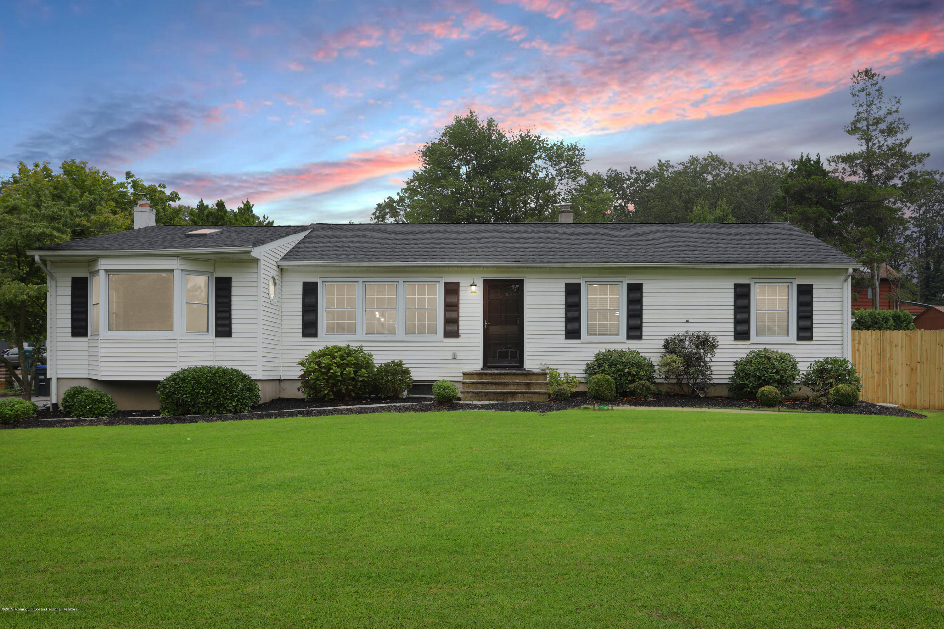 1822 Carmerville Road Wall, NJ 07719 - Photo 25 of 25 a front view of a house with a garden and yard