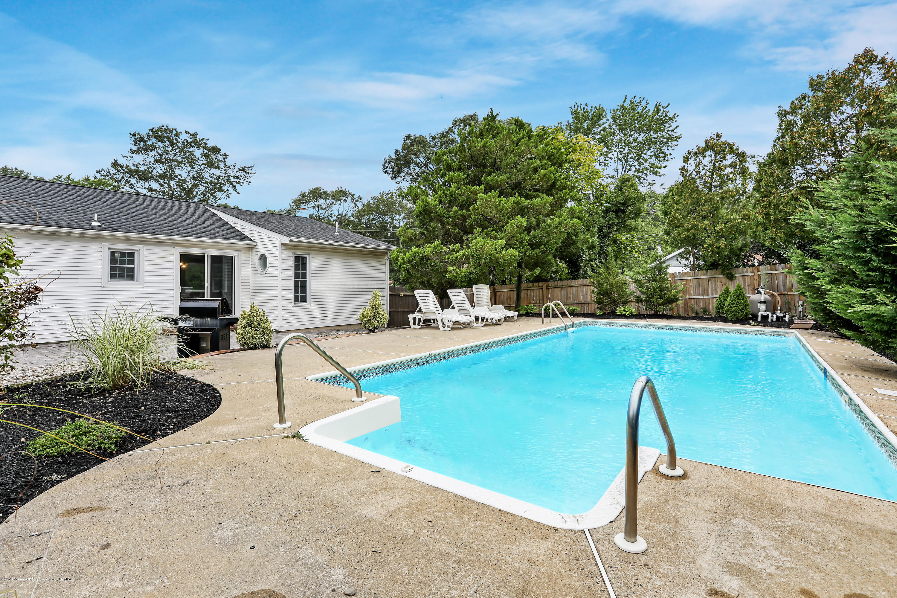 1822 Carmerville Road Wall, NJ 07719 - Photo 4 of 25 a view of a house with pool porch and chairs