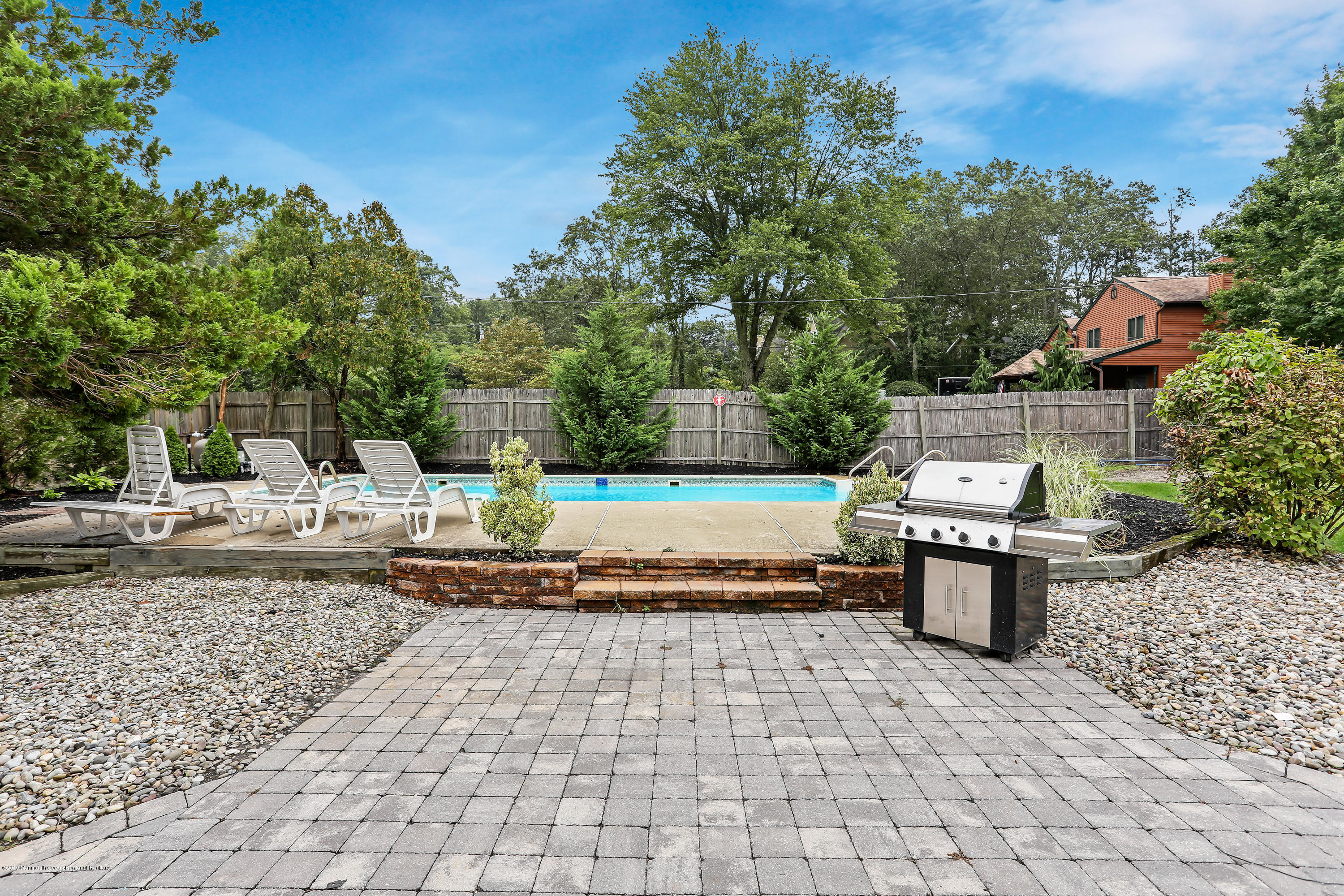 1822 Carmerville Road Wall, NJ 07719 - Photo 6 of 25 a view of a backyard with sitting area