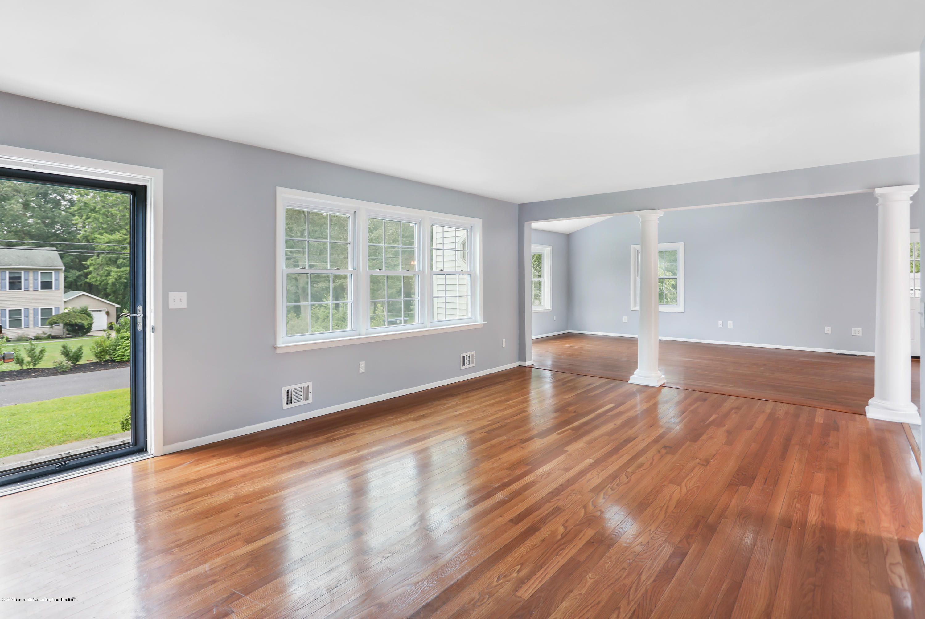 1822 Carmerville Road Wall, NJ 07719 - Photo 9 of 25 a view of an empty room with wooden floor and a window