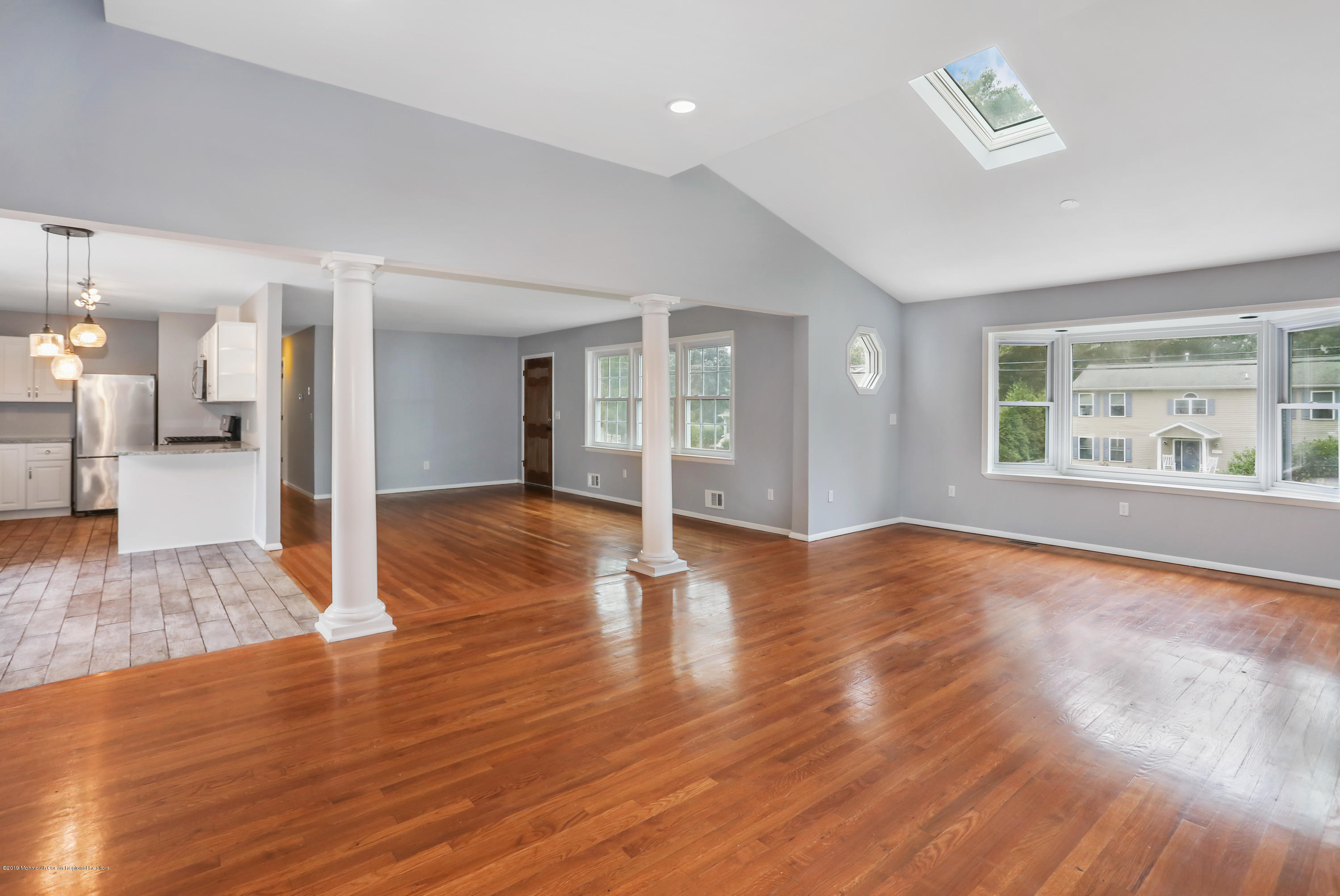 1822 Carmerville Road Wall, NJ 07719 - Photo 10 of 25 a view of a livingroom with wooden floor and a window