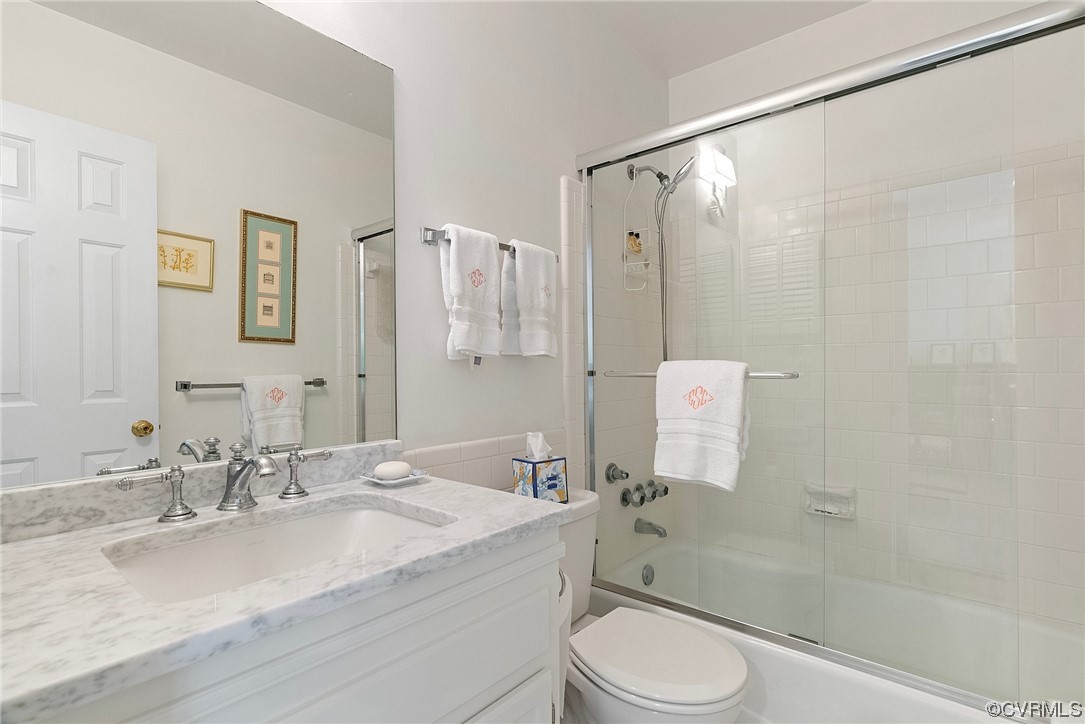 300 North Ridge Road, Unit 70 Henrico, VA 23229 - Photo 34 of 36 a bathroom with a granite countertop sink toilet and shower