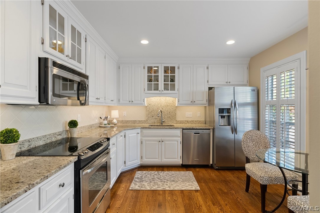 300 North Ridge Road, Unit 70 Henrico, VA 23229 - Photo 7 of 36 a kitchen with a sink stove and refrigerator
