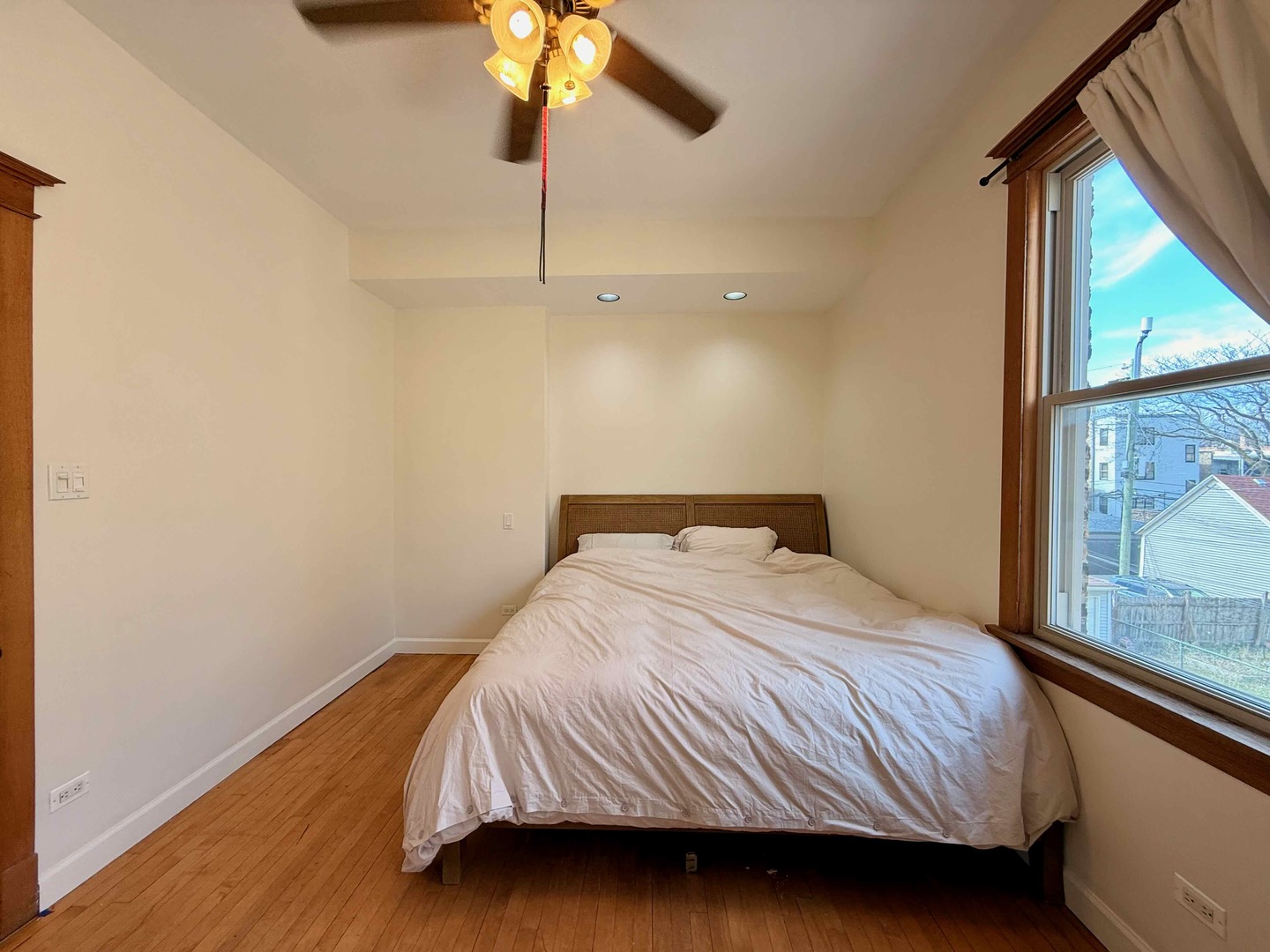2414 North Spaulding Avenue, Unit 2F Chicago, IL 60647 - Photo 18 of 30 a bedroom with a bed and a chandelier