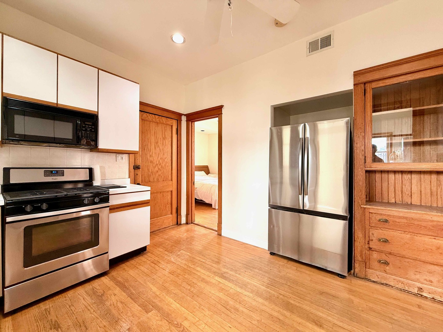 2414 North Spaulding Avenue, Unit 2F Chicago, IL 60647 - Photo 22 of 30 a kitchen with stainless steel appliances granite countertop a refrigerator microwave and sink