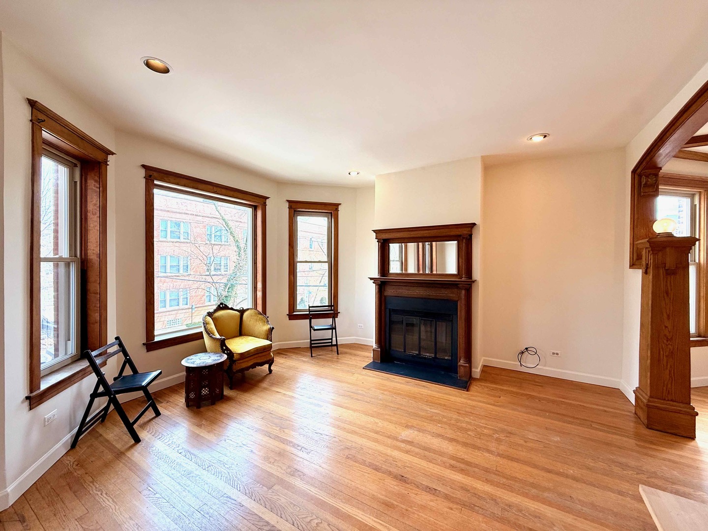 2414 North Spaulding Avenue, Unit 2F Chicago, IL 60647 - Photo 7 of 30 a living room with furniture and a fireplace