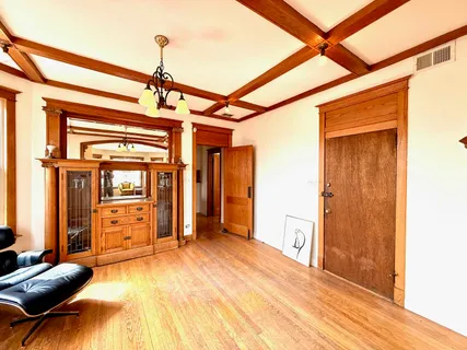 a view of a bedroom with furniture and window