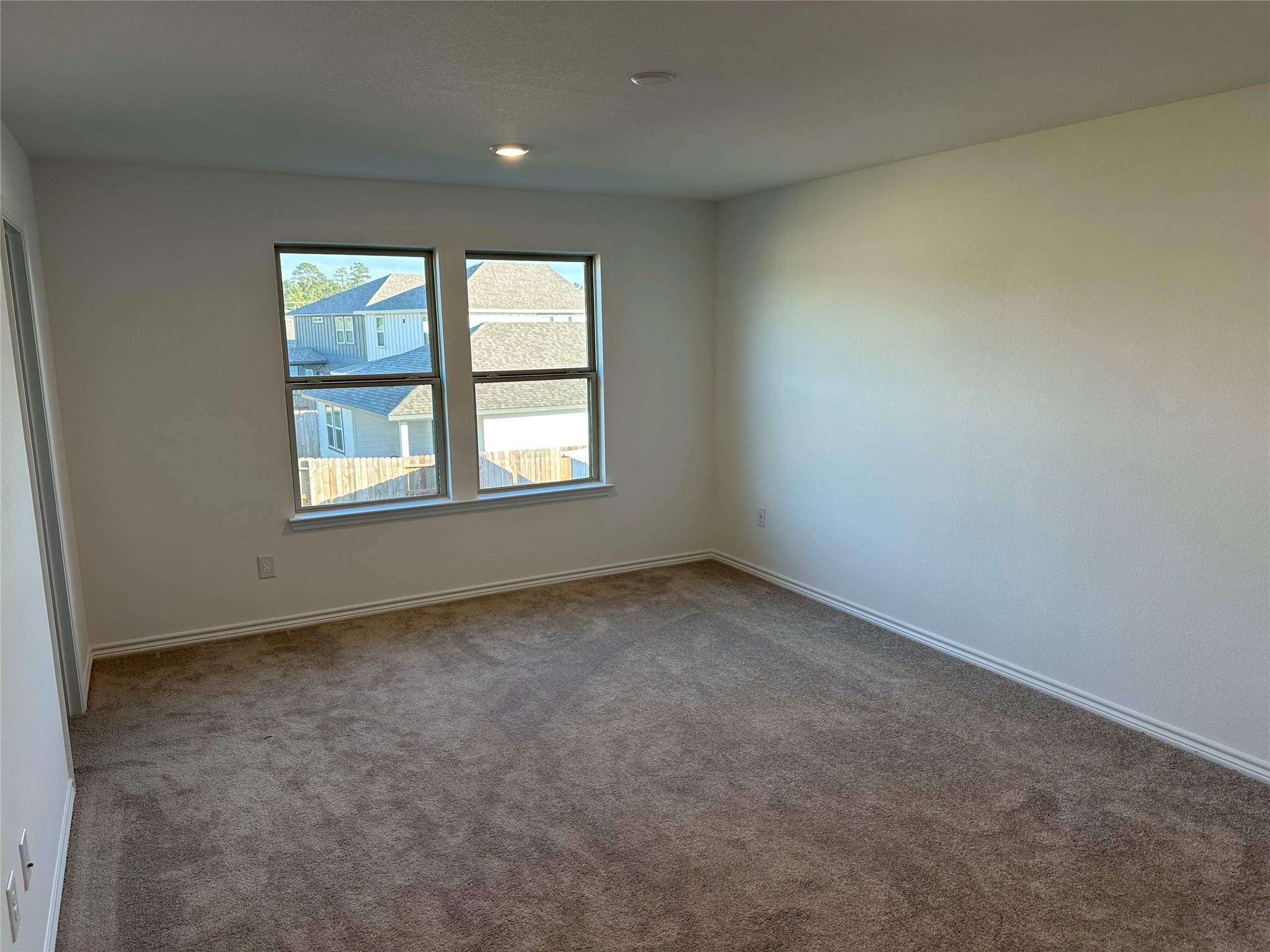 15214 Canyon Rapids Road Conroe, TX 77302 - Photo 13 of 22 an empty room with a window