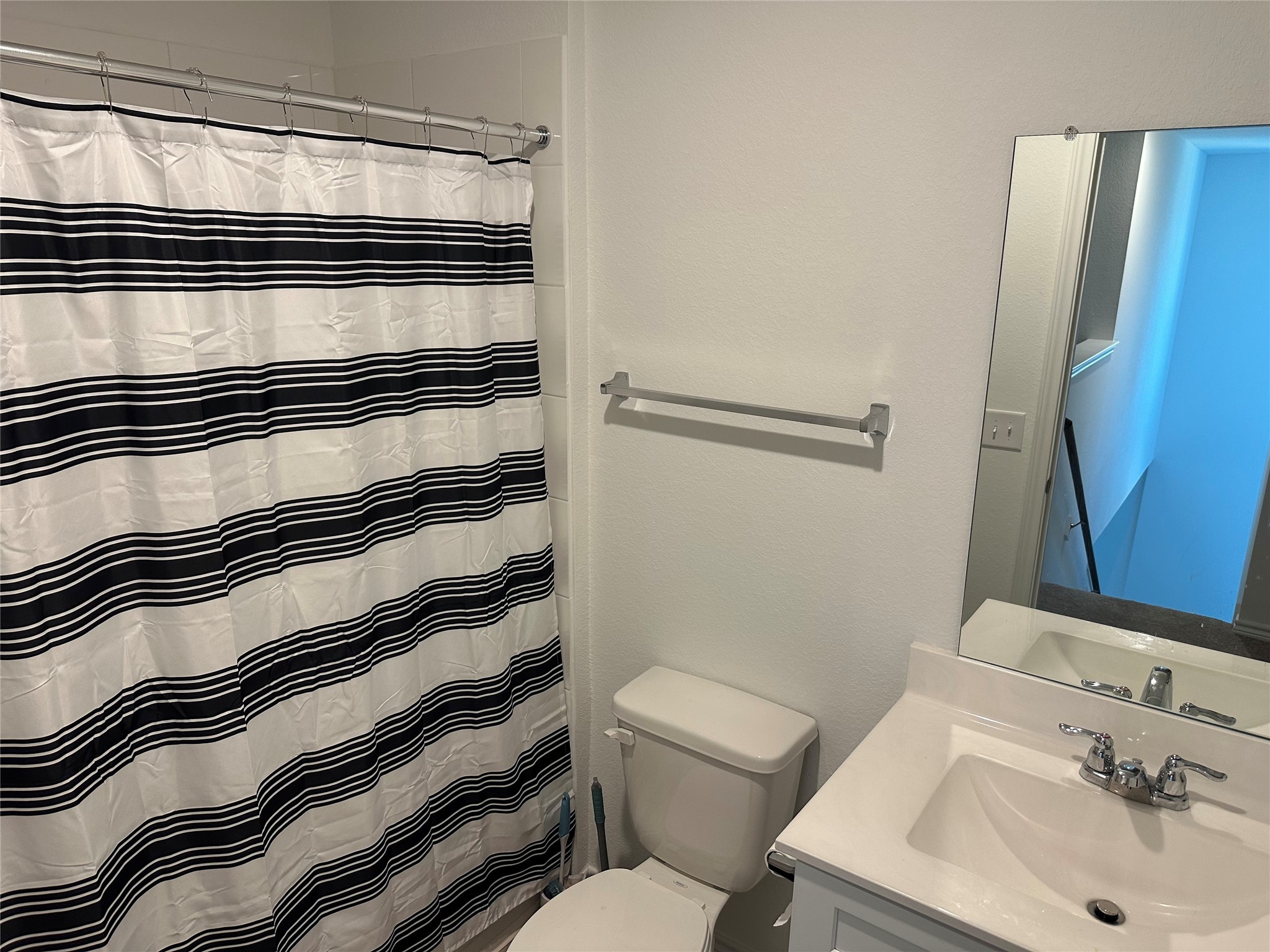 15214 Canyon Rapids Road Conroe, TX 77302 - Photo 14 of 22 a bathroom with a sink and a mirror