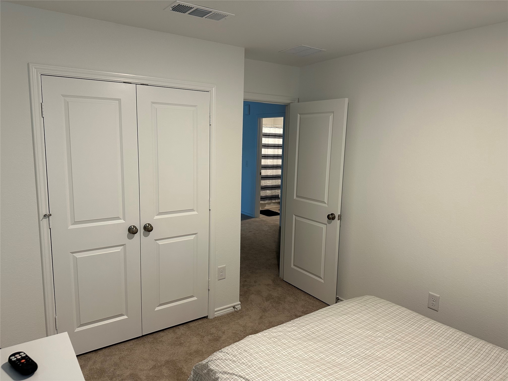 15214 Canyon Rapids Road Conroe, TX 77302 - Photo 16 of 22 a bedroom with a bed and a bathroom