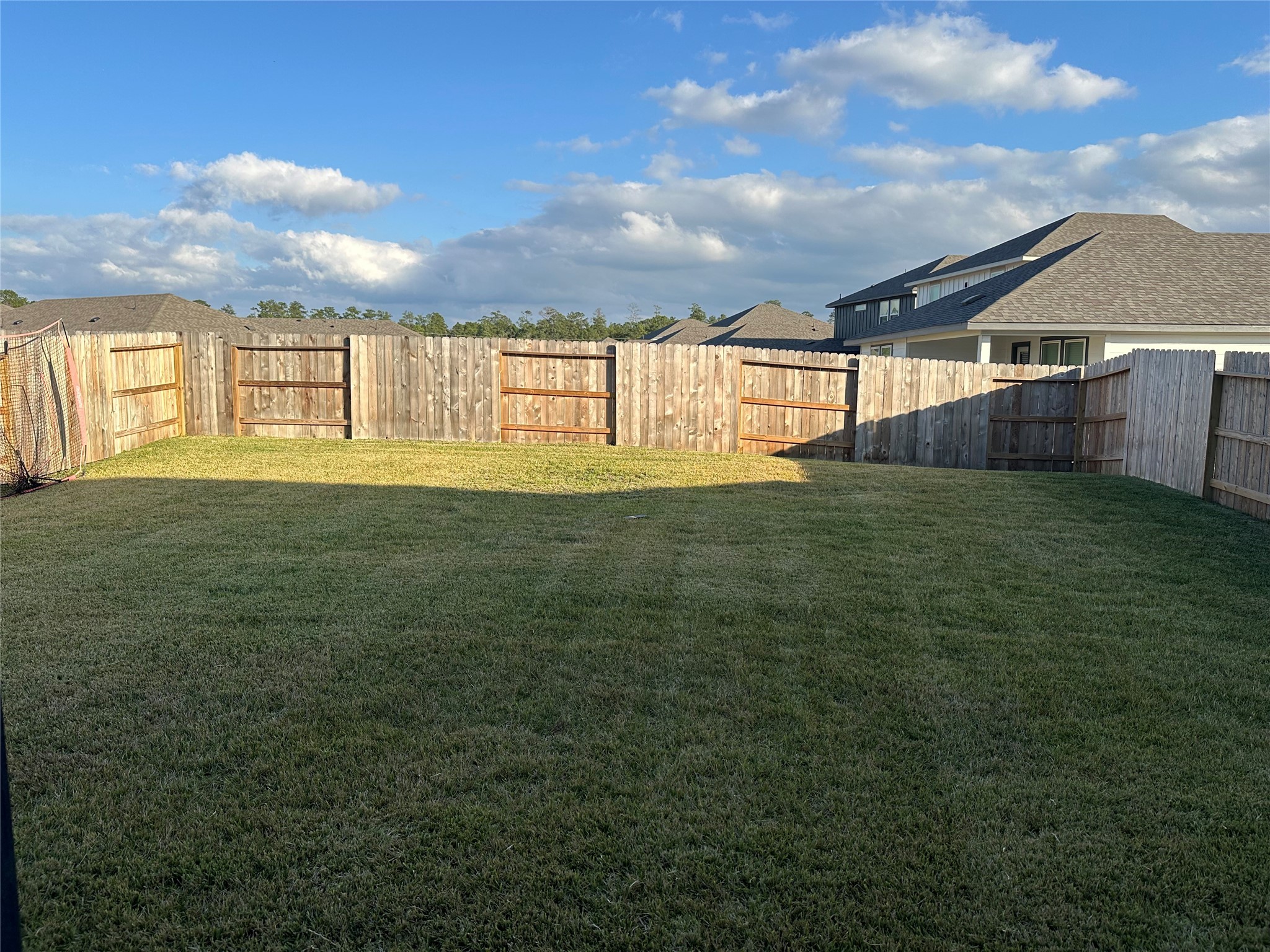 15214 Canyon Rapids Road Conroe, TX 77302 - Photo 21 of 22 a view of an house with backyard space and balcony