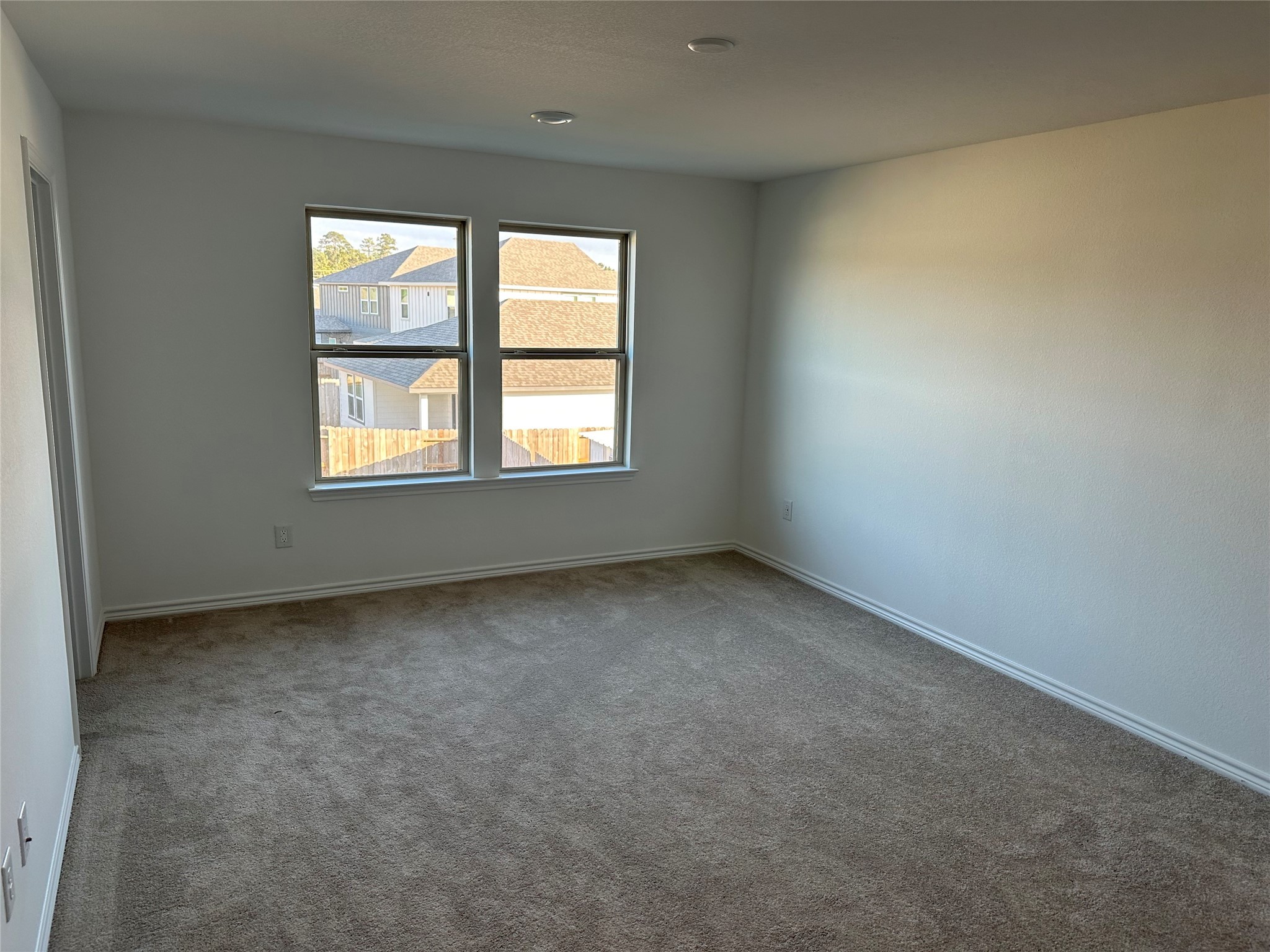 15214 Canyon Rapids Road Conroe, TX 77302 - Photo 8 of 22 an empty room with windows