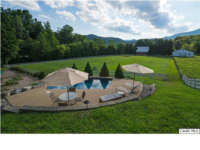 216 Quaker Run Road Madison, VA 22727 - Photo 32 of 48 The hillside climbs gently behind the pool, and the views become more panoramic.