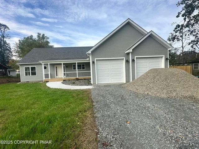a view of house with garage