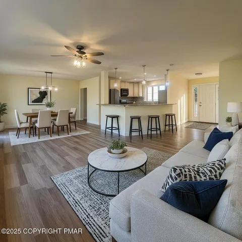 a view of small space with wooden floor and windows