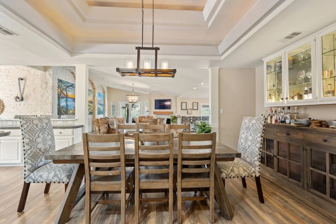 925 Challenger Lakeway, TX 78734 - Photo 11 of 40 a view of a dining room with furniture window and wooden floor