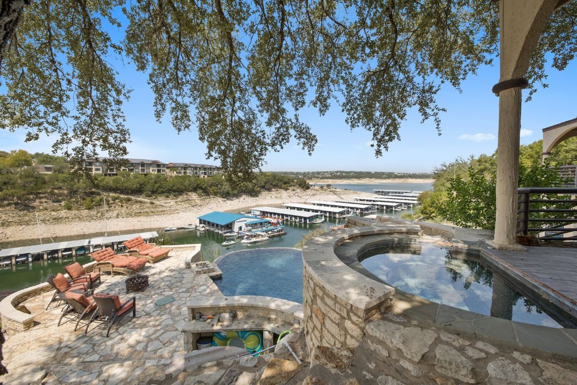925 Challenger Lakeway, TX 78734 - Photo 2 of 40 a view of a swimming pool with a yard