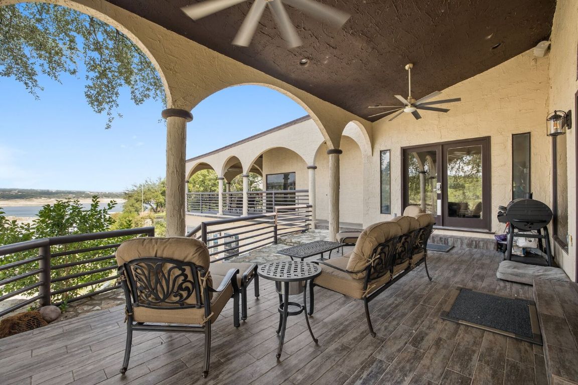 925 Challenger Lakeway, TX 78734 - Photo 23 of 40 a view of a balcony with furniture and wooden floor